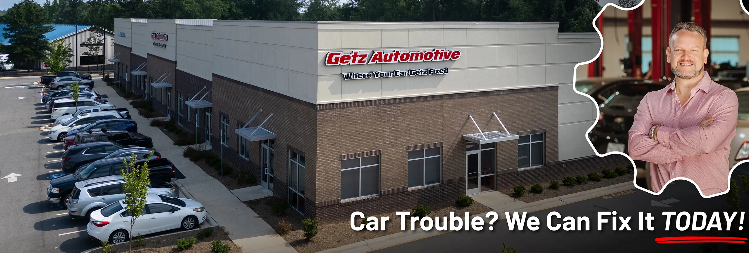 Getz Automotive shop exterior with owner and parked cars